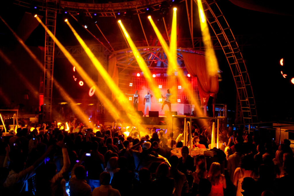 Vibrant nightclub scene with bright stage lights
